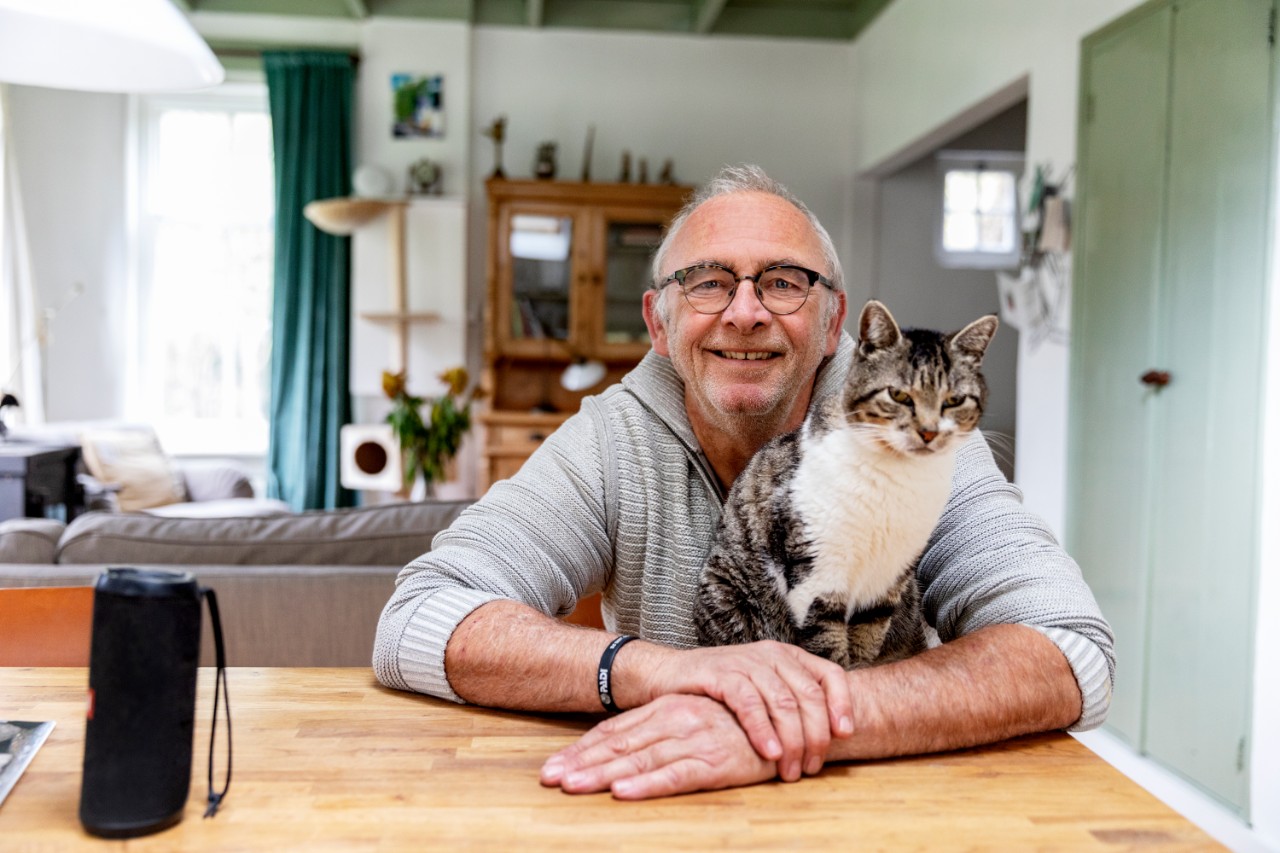 A man with a cat